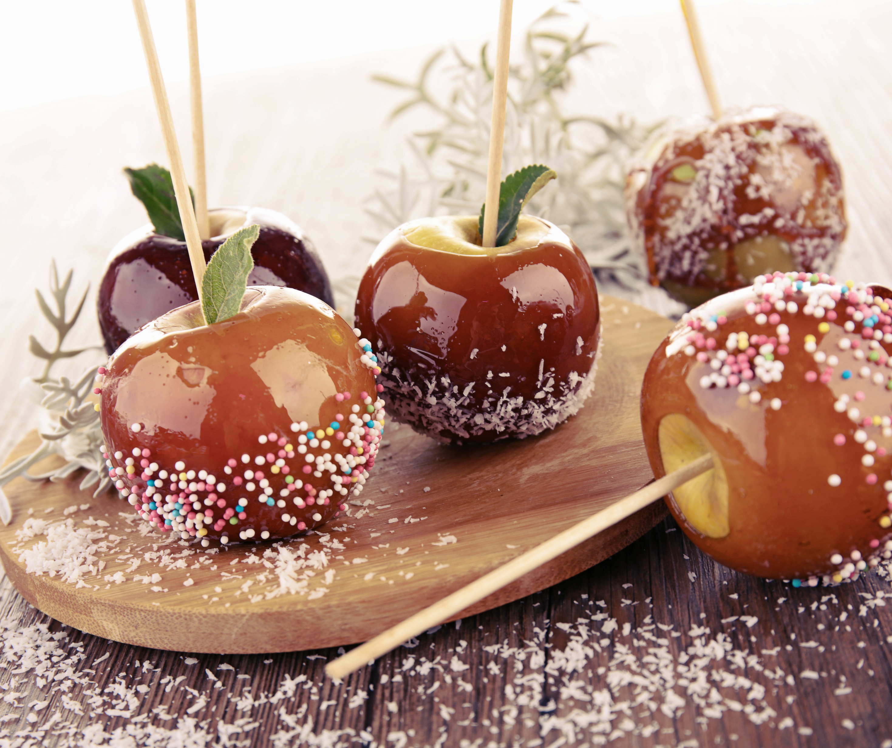 Candy apples with sprinkles and decorations, perfect for Halloween in New York.