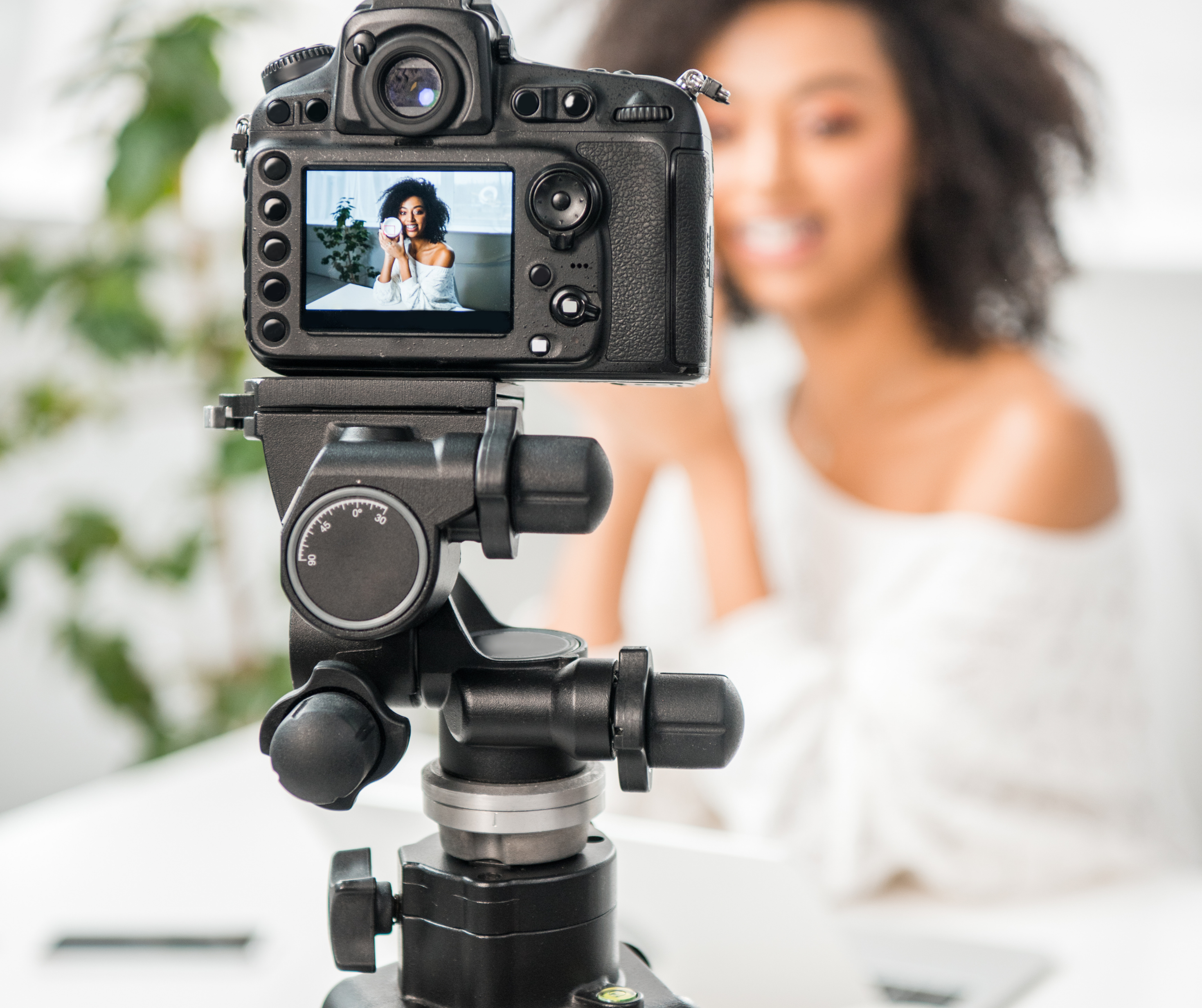 Influencer holding product during a live streaming session, symbolizing collaboration with influencers