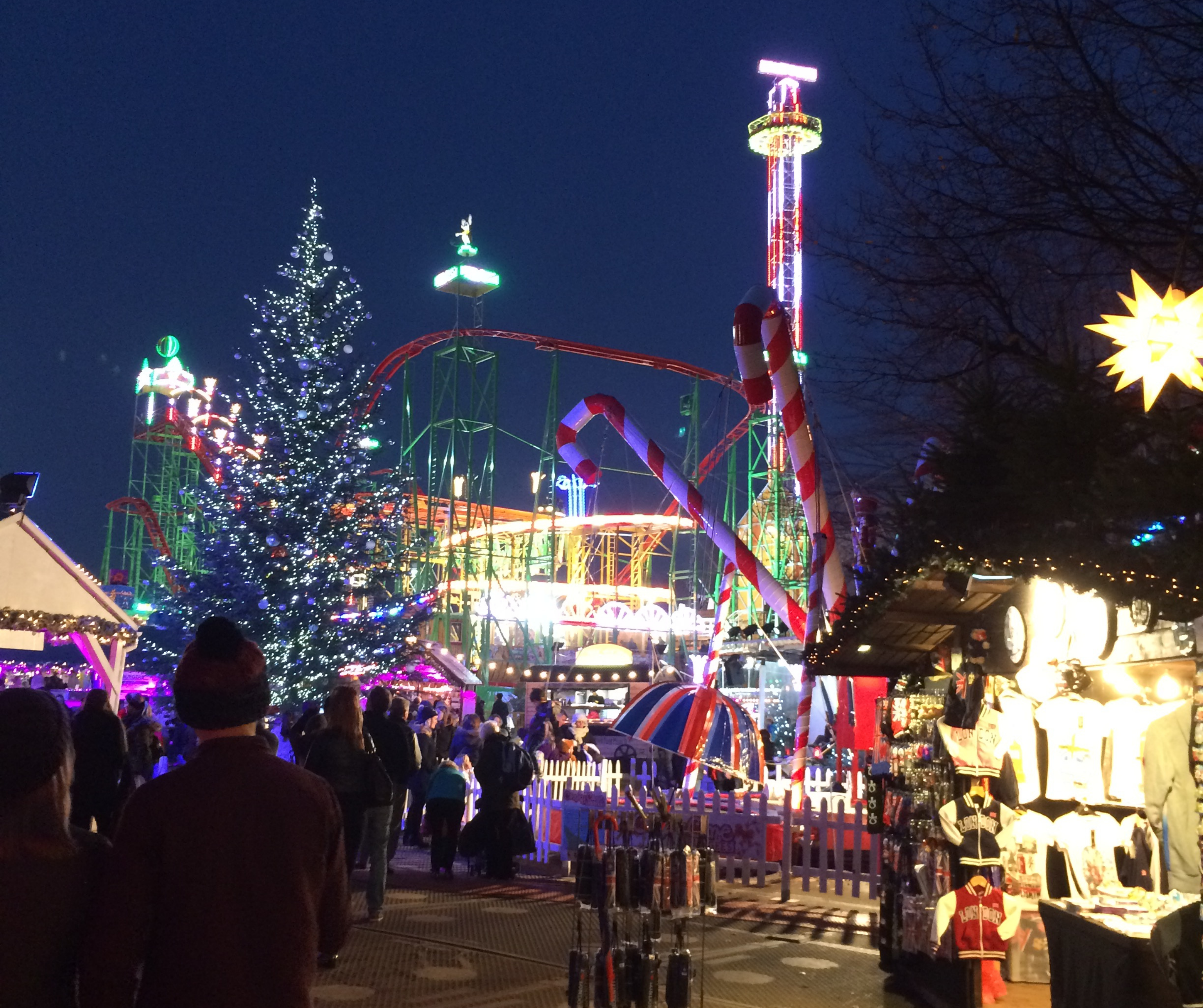 Winter Wonderland amusement park at night with Christmas decorations and lights.