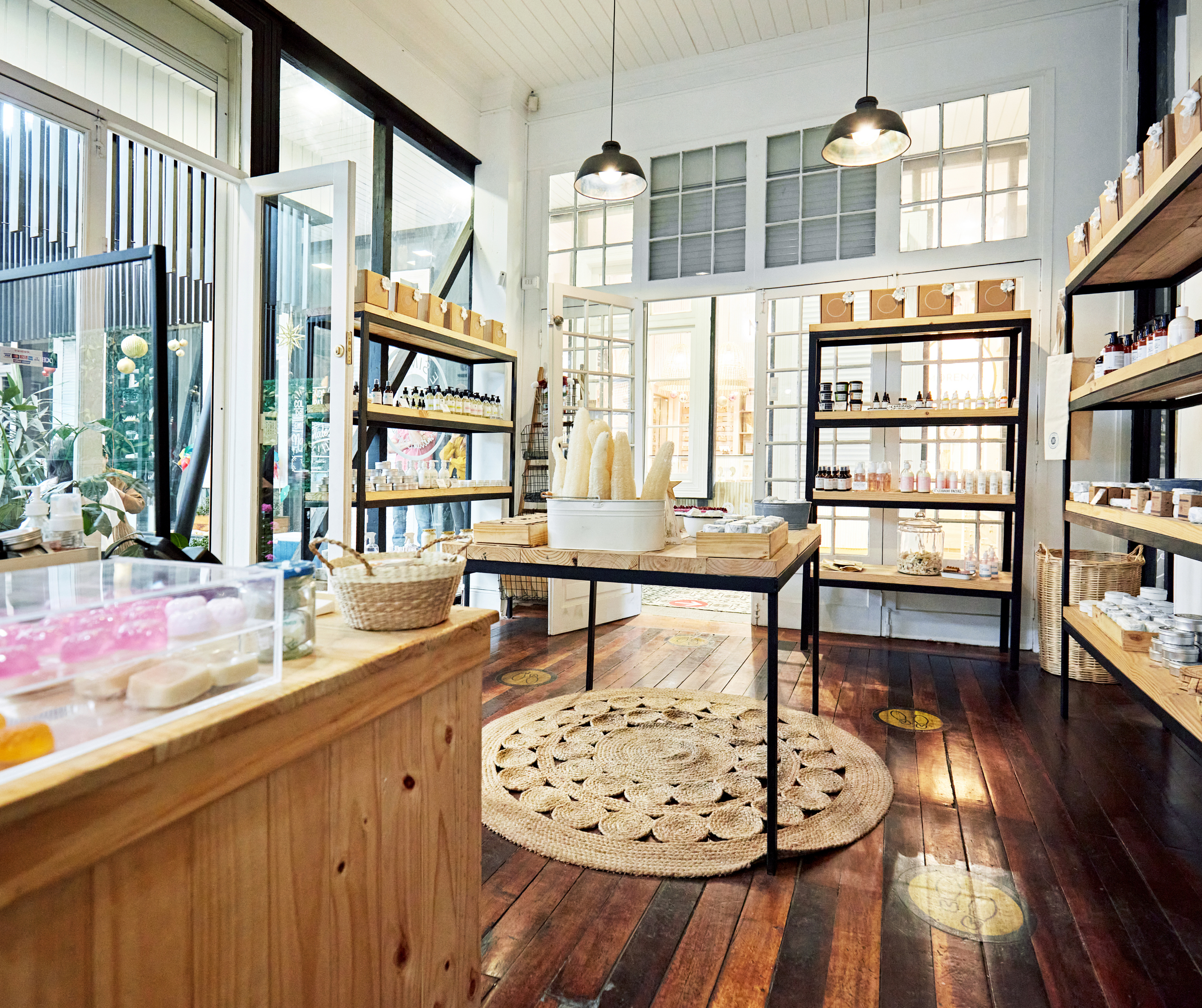 An interior view of a natural health store with shelves displaying health and wellness products, and a cozy ambiance.