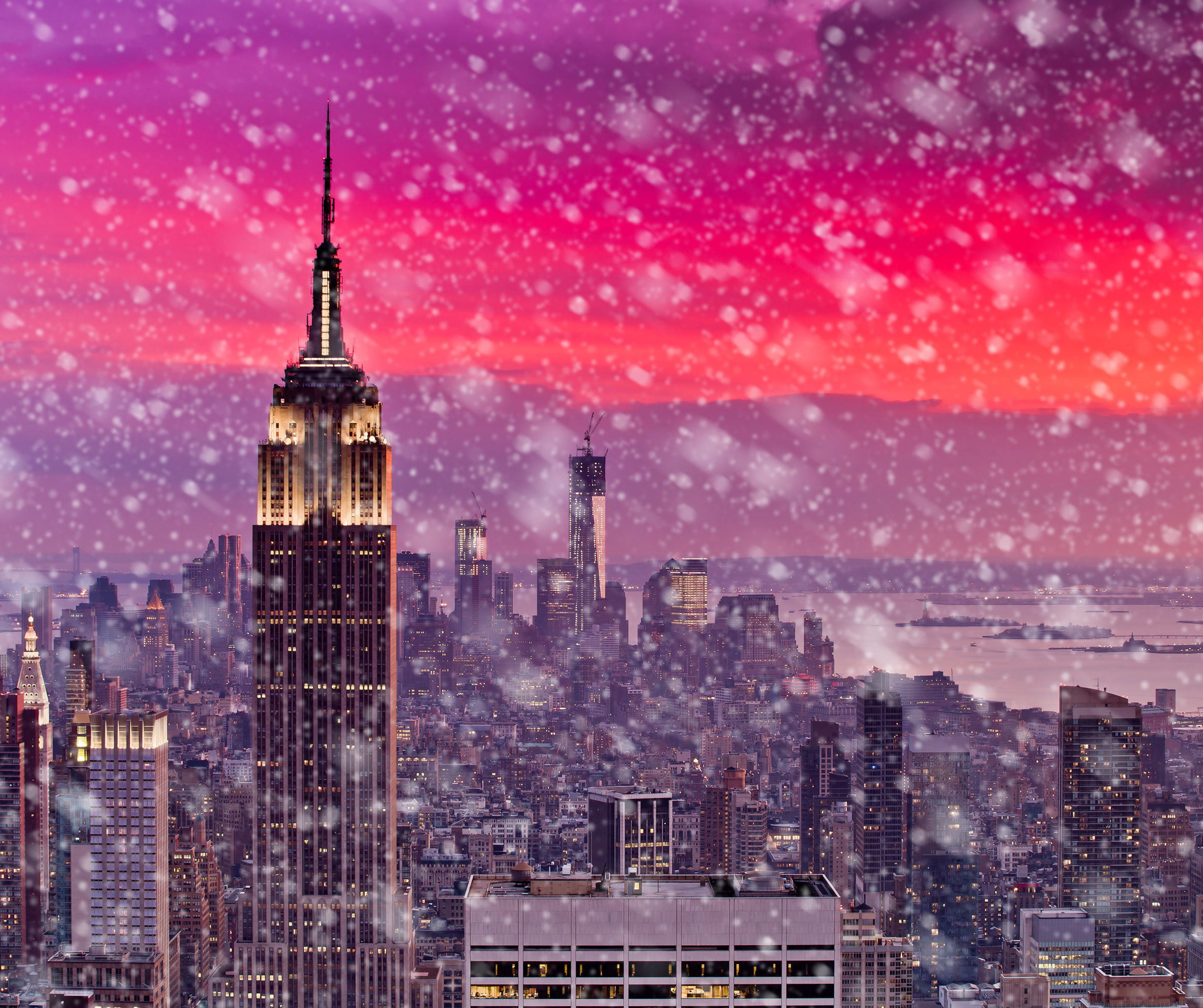 A picturesque view of New York City covered in snow, showcasing the city's famous skyline under a blanket of white.