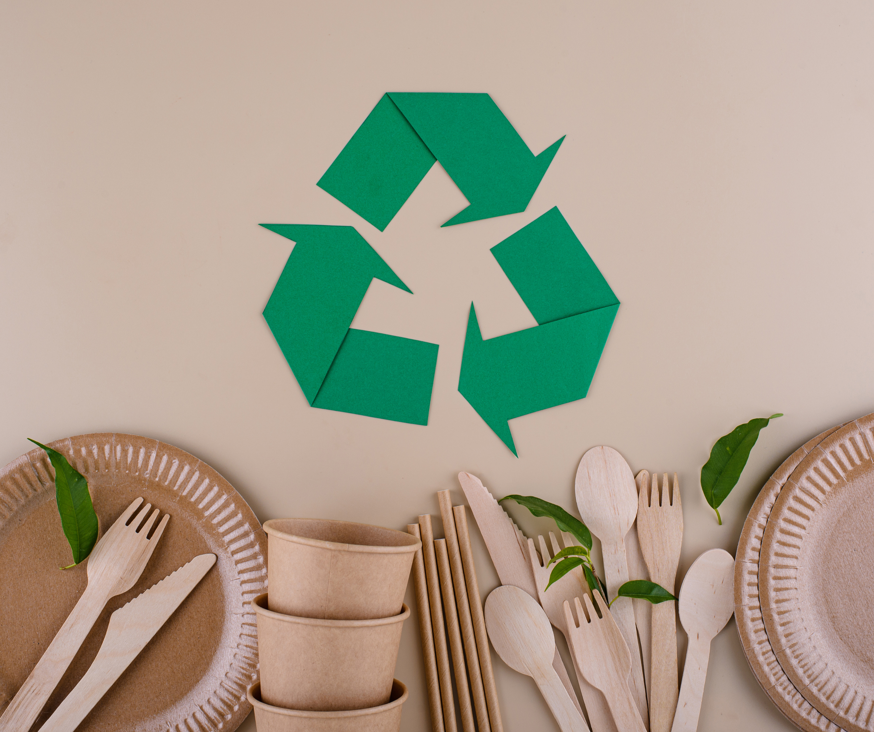 A selection of eco-friendly packaging options used in a pop-up dining event, including biodegradable containers, compostable plates, and reusable cutlery, promoting sustainable practices.