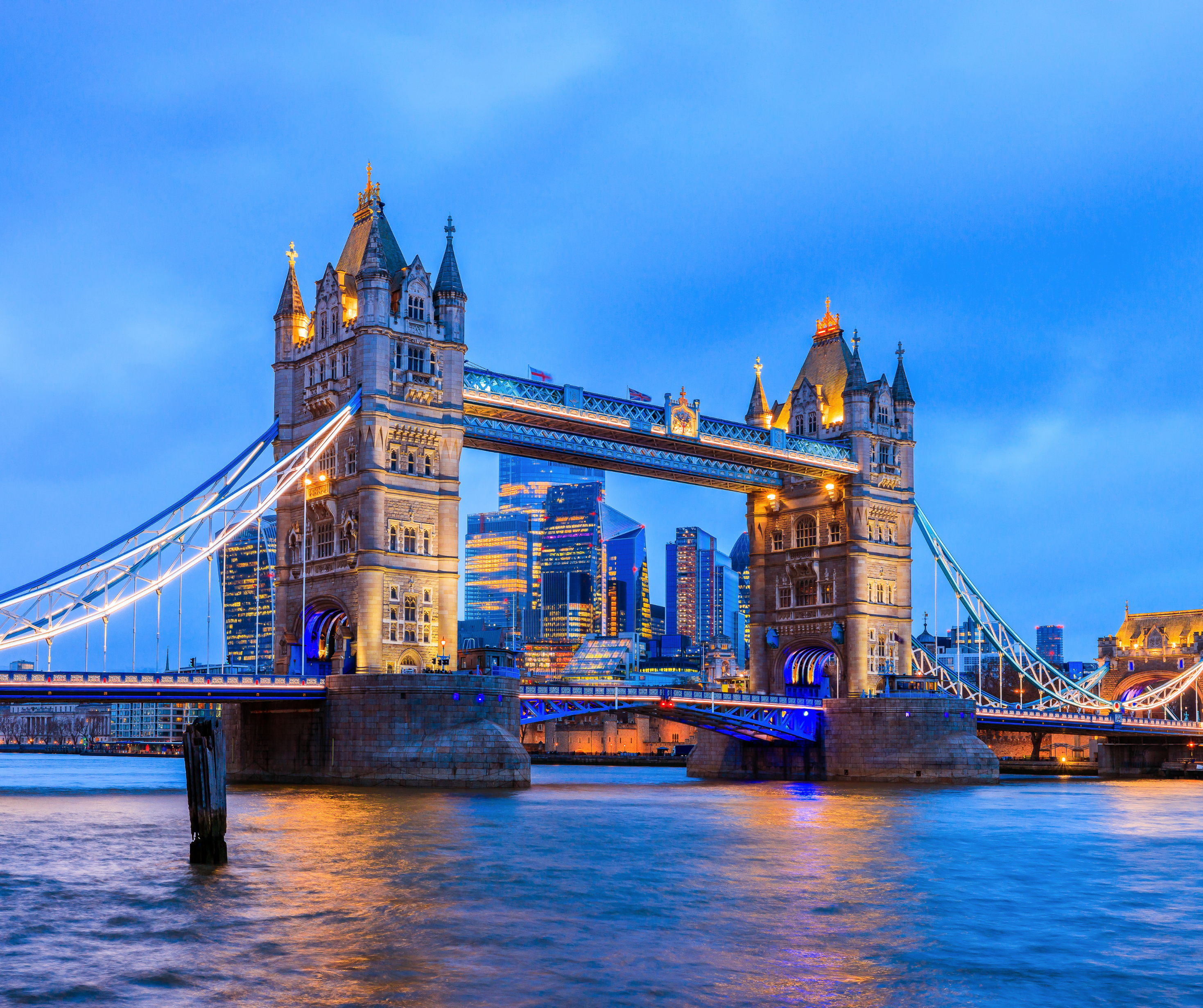 A view of London's famous landmarks, including the Tower Bridge and the London Eye.