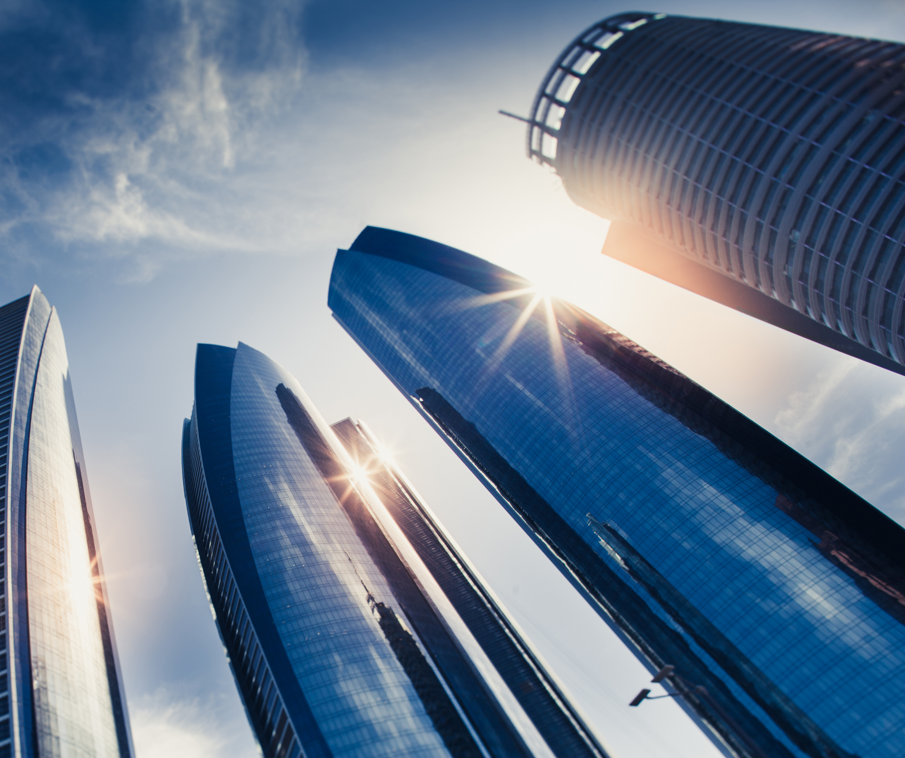 A panoramic view of Abu Dhabi's skyline featuring modern skyscrapers, representing the diverse and dynamic consumer market in the city.