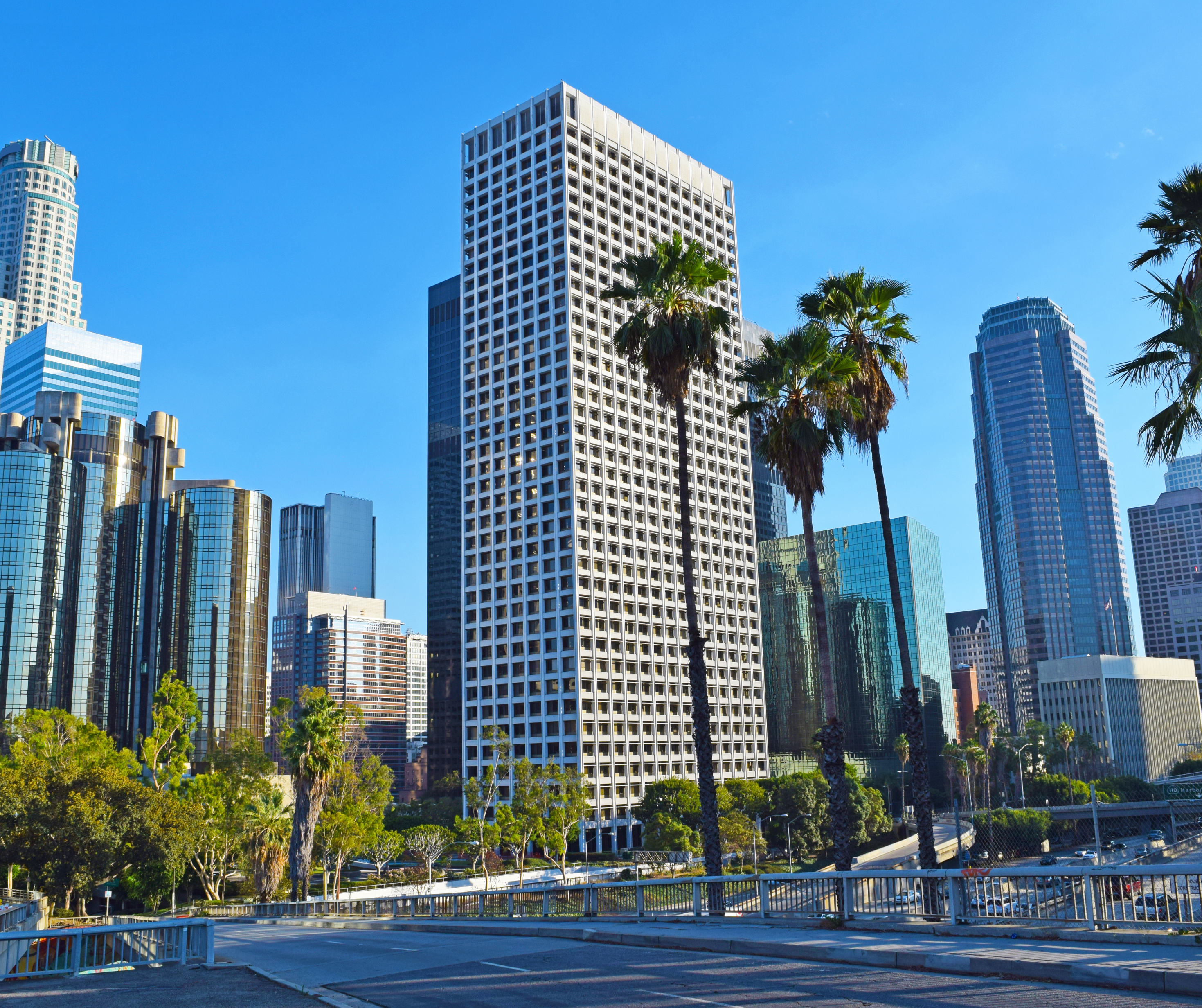 Panoramic view of downtown Los Angeles with prominent skyscrapers and cityscape.