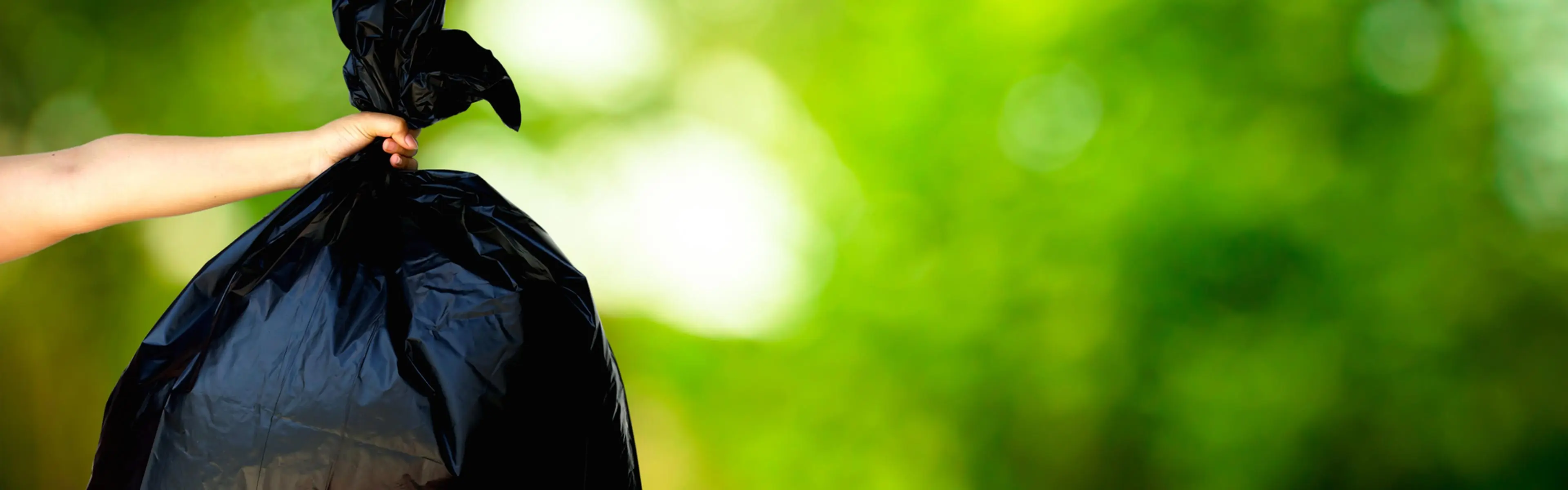 Co-ex avfallssekk på grønn bakgrunn