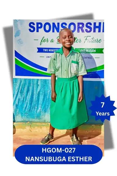 Girl in a green and white striped school uniform smiling in front of a banner