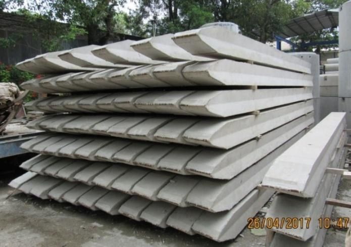 Stack of precast concrete sheet piles awaiting installation