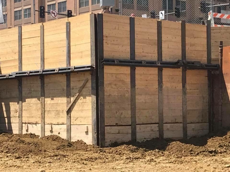 H-iron soldier piles with horizontal timber lagging retaining an excavation