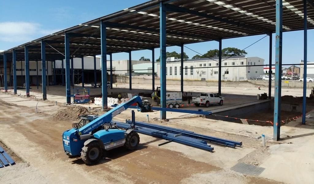 Erected structural steel portal frame for a large industrial building