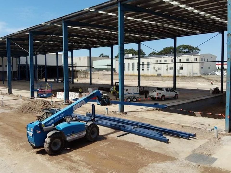 Erected structural steel portal frame for a large industrial building