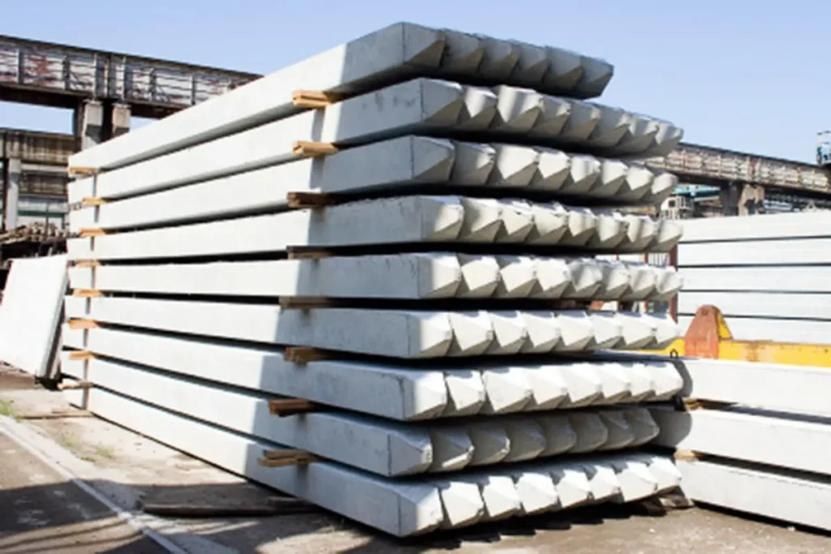 Precast concrete sheet piles stacked in a casting yard