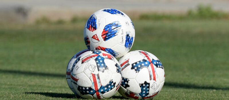 Photo of three footballs