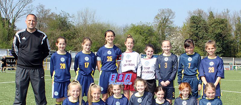 Photo of the 2017 girls team with manager