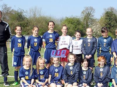 Photo of the 2017 girls team with manager