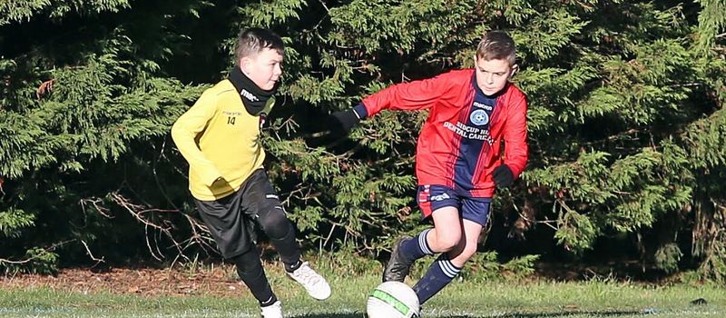 Photo of two players contesting the ball