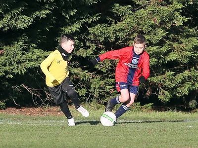 Photo of two players contesting the ball
