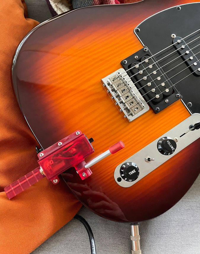Image of prototype 2 mounted on a guitar.