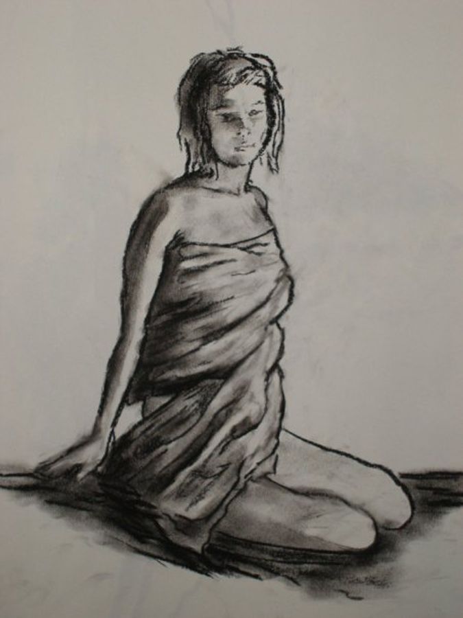 Charcoal portrait of a woman sitting while wrapped in cloth