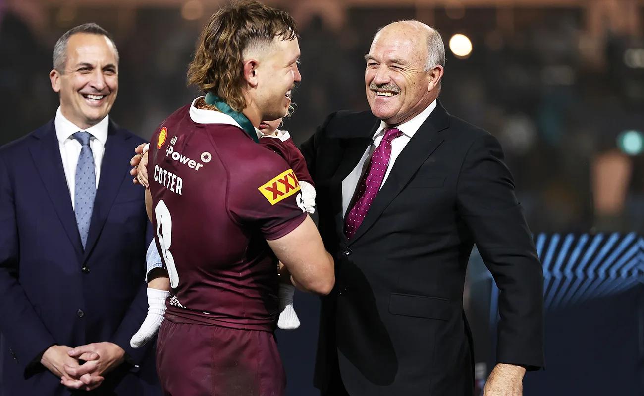 Wally lewis presenting medal to Rueben Cotter