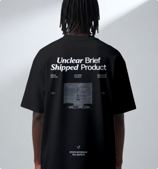The back of a black Ghost Savvy t-shirt reading “Unclear brief, shipped product.”