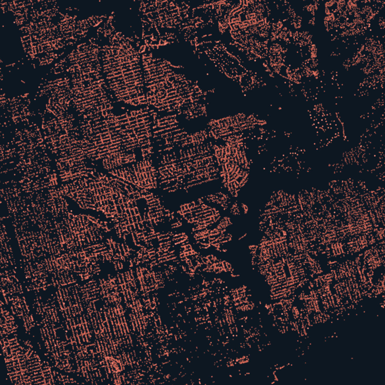 Thousands of maple street trees as warm dots on a dark ground, ravines showing as empty voids