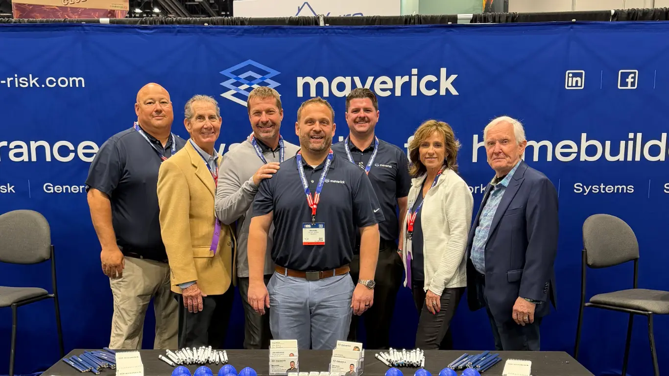 Maverick team posing together at their trade show booth