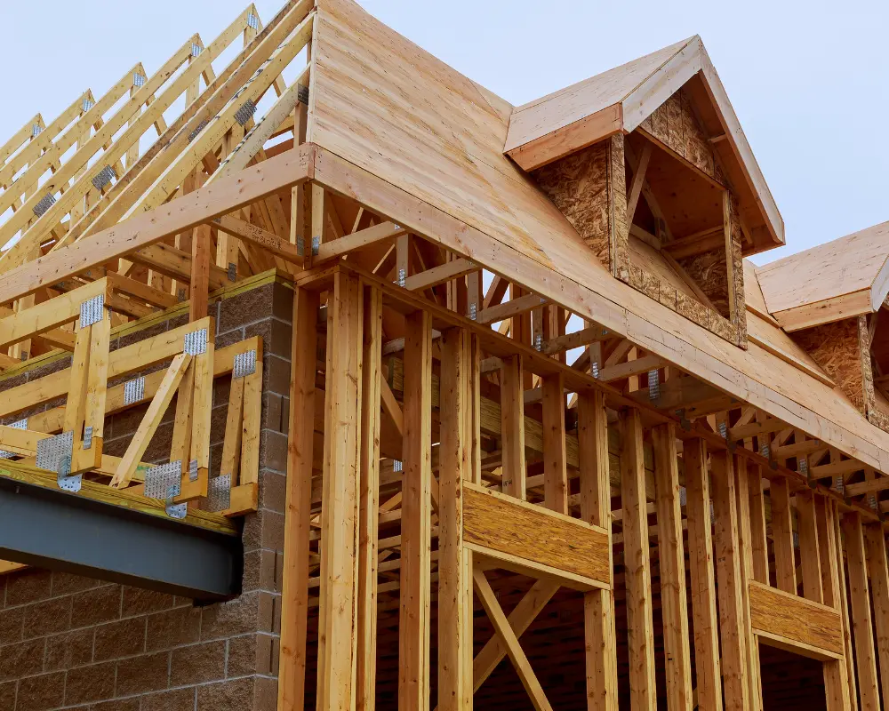 Home under construction with wood framing during early build phase
