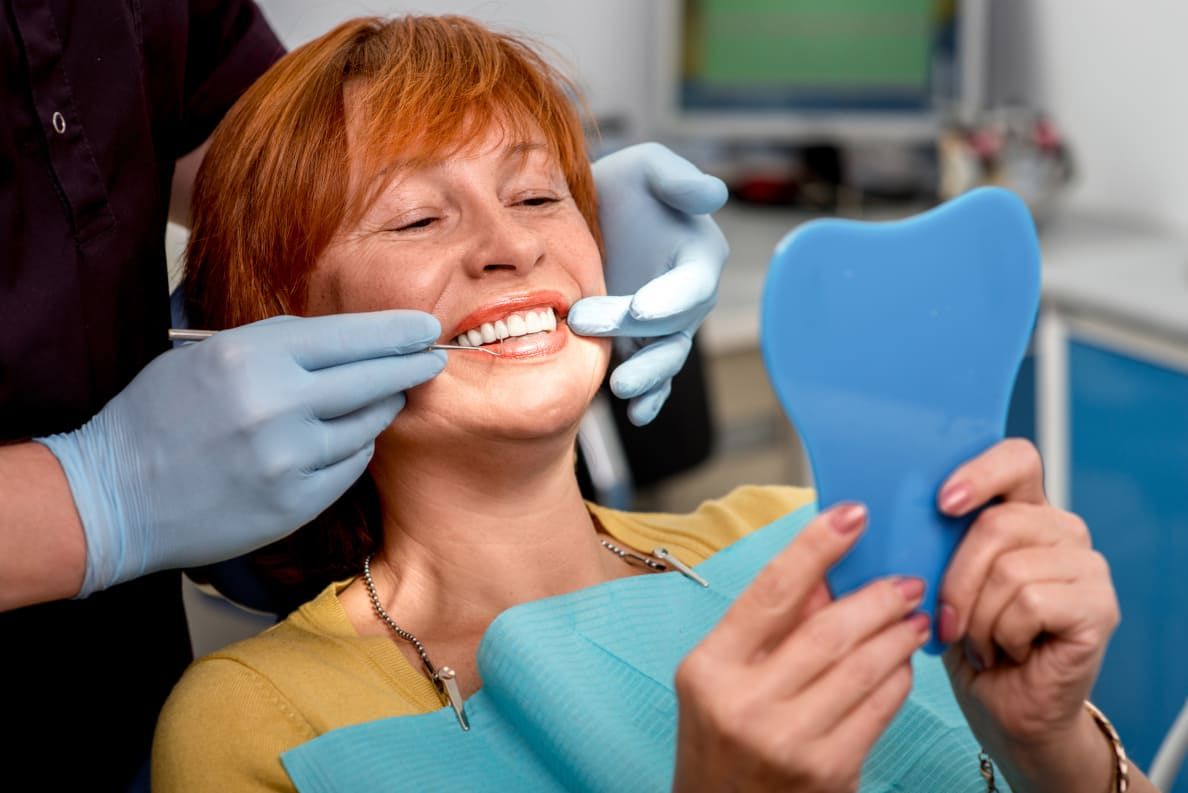 woman with implant facing a mirror