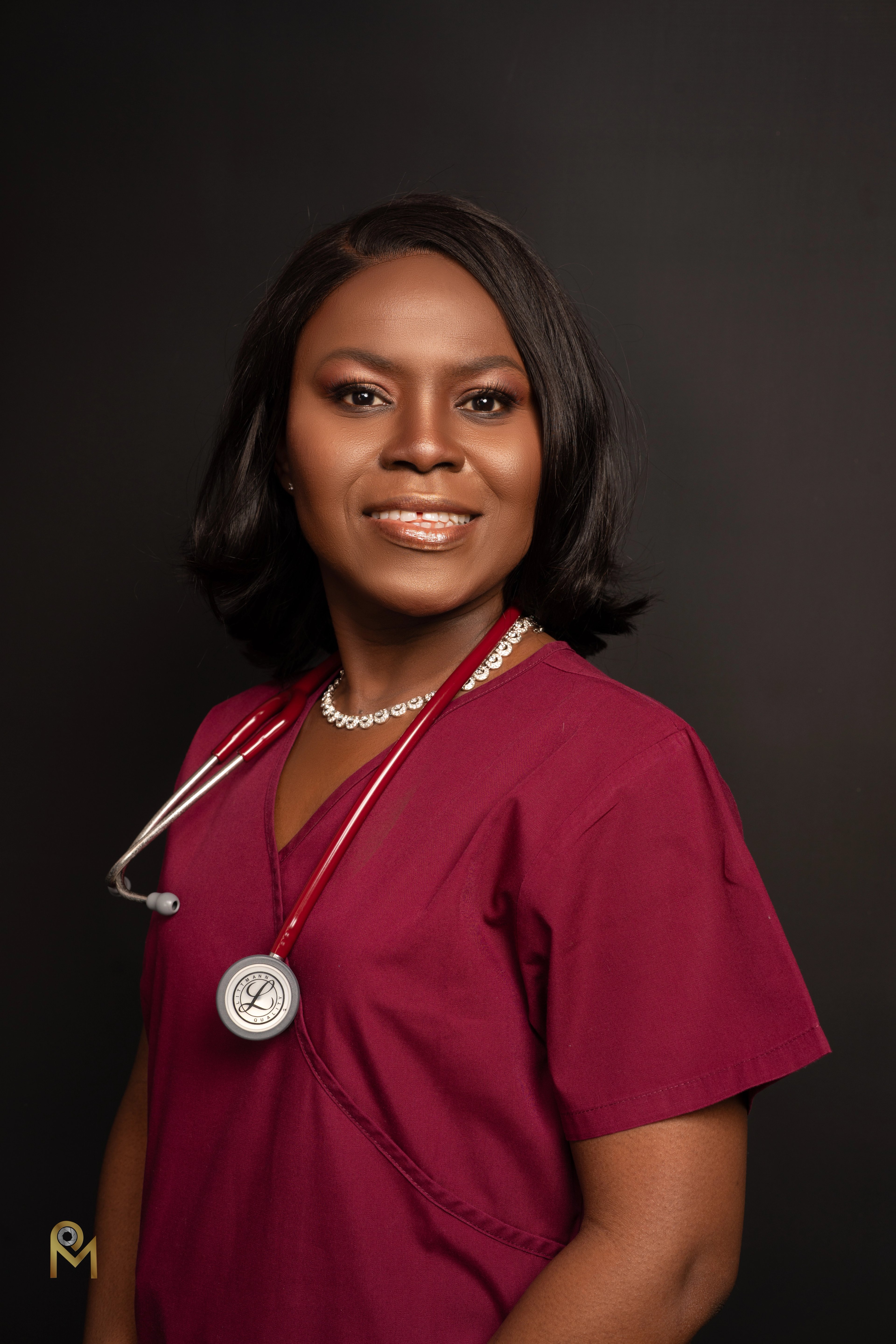 Professional headshot on a dark studio backdrop