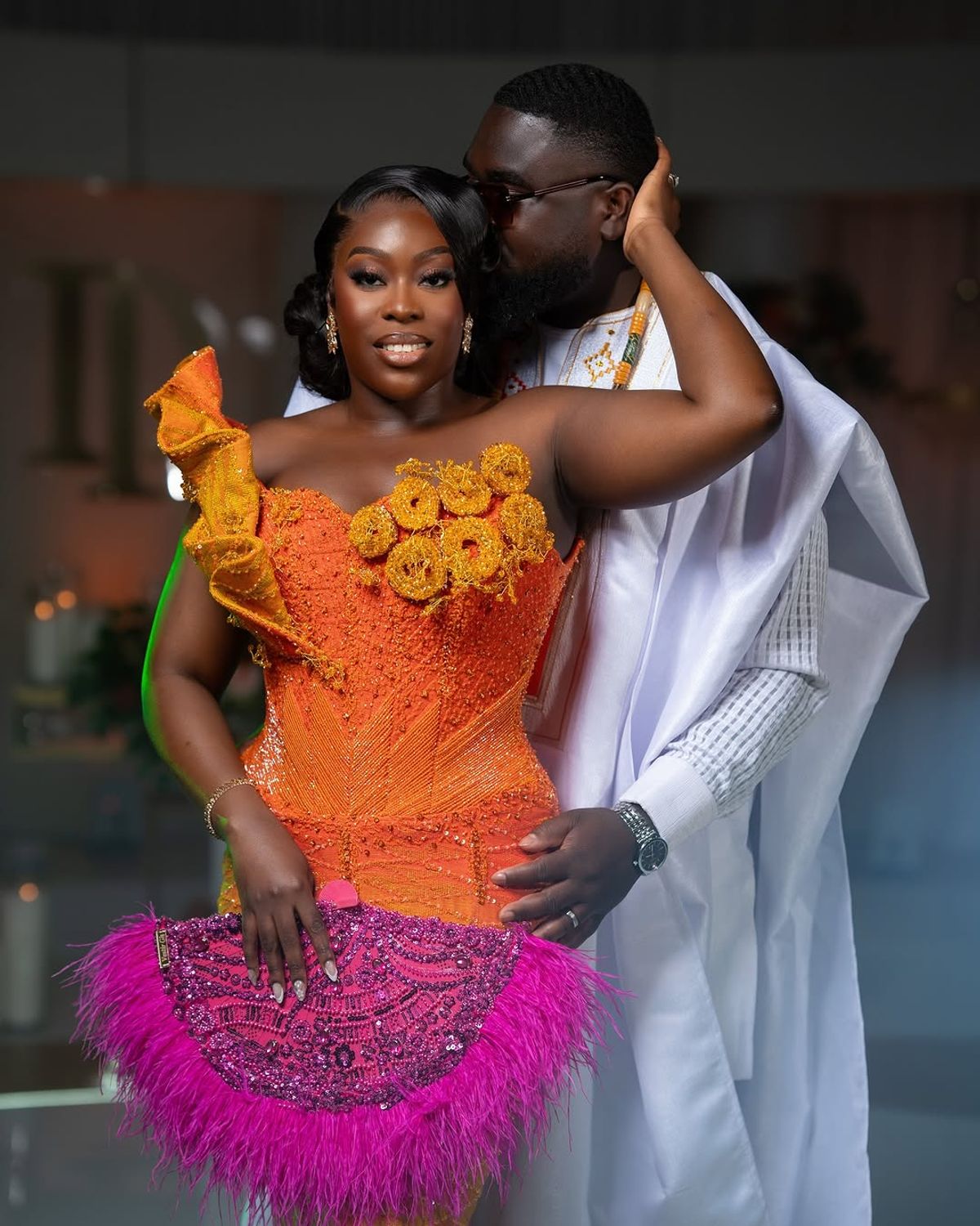 Bride laughing with bridesmaids before ceremony