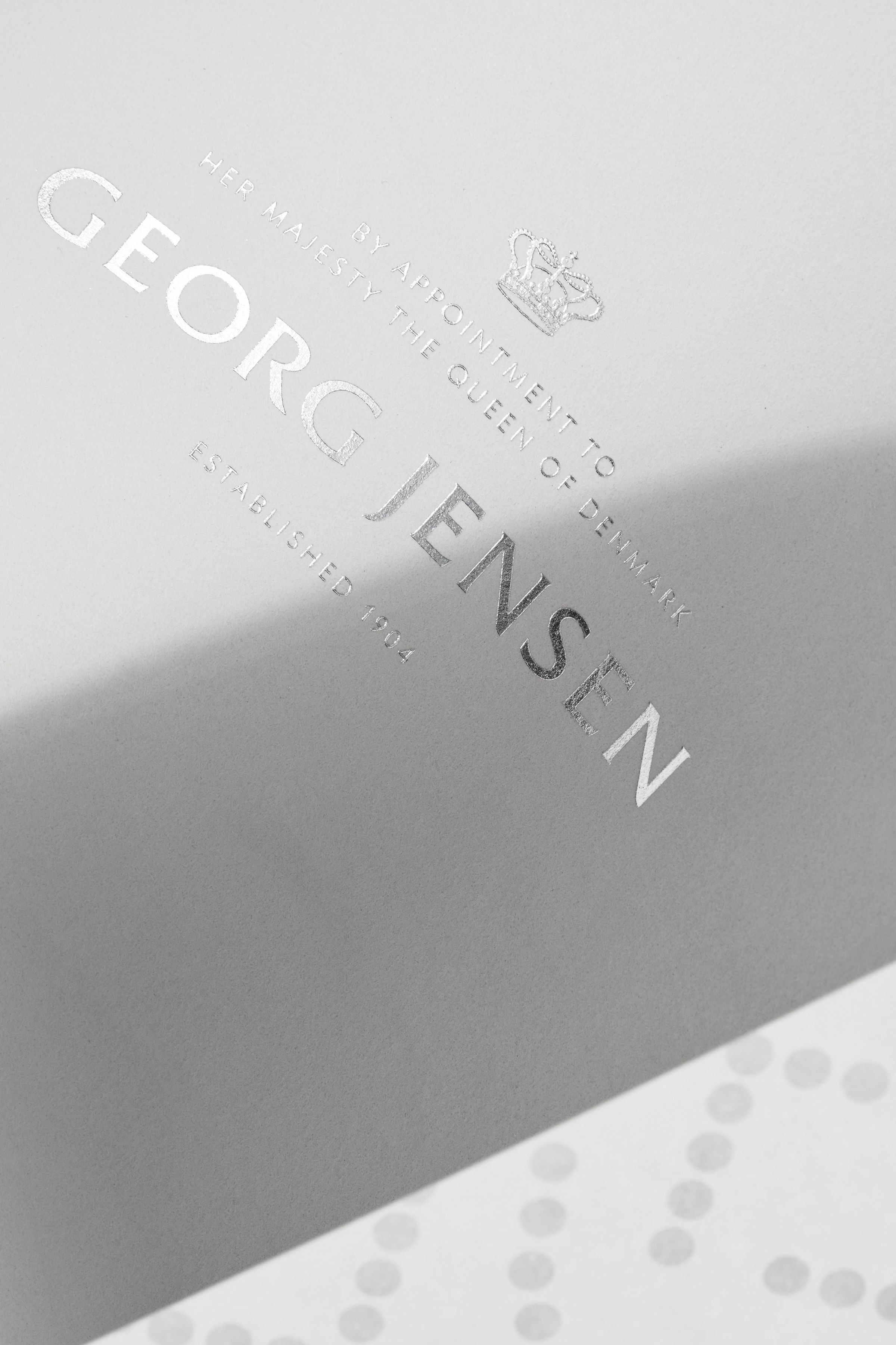 Georg Jensen logo in silver foil detail