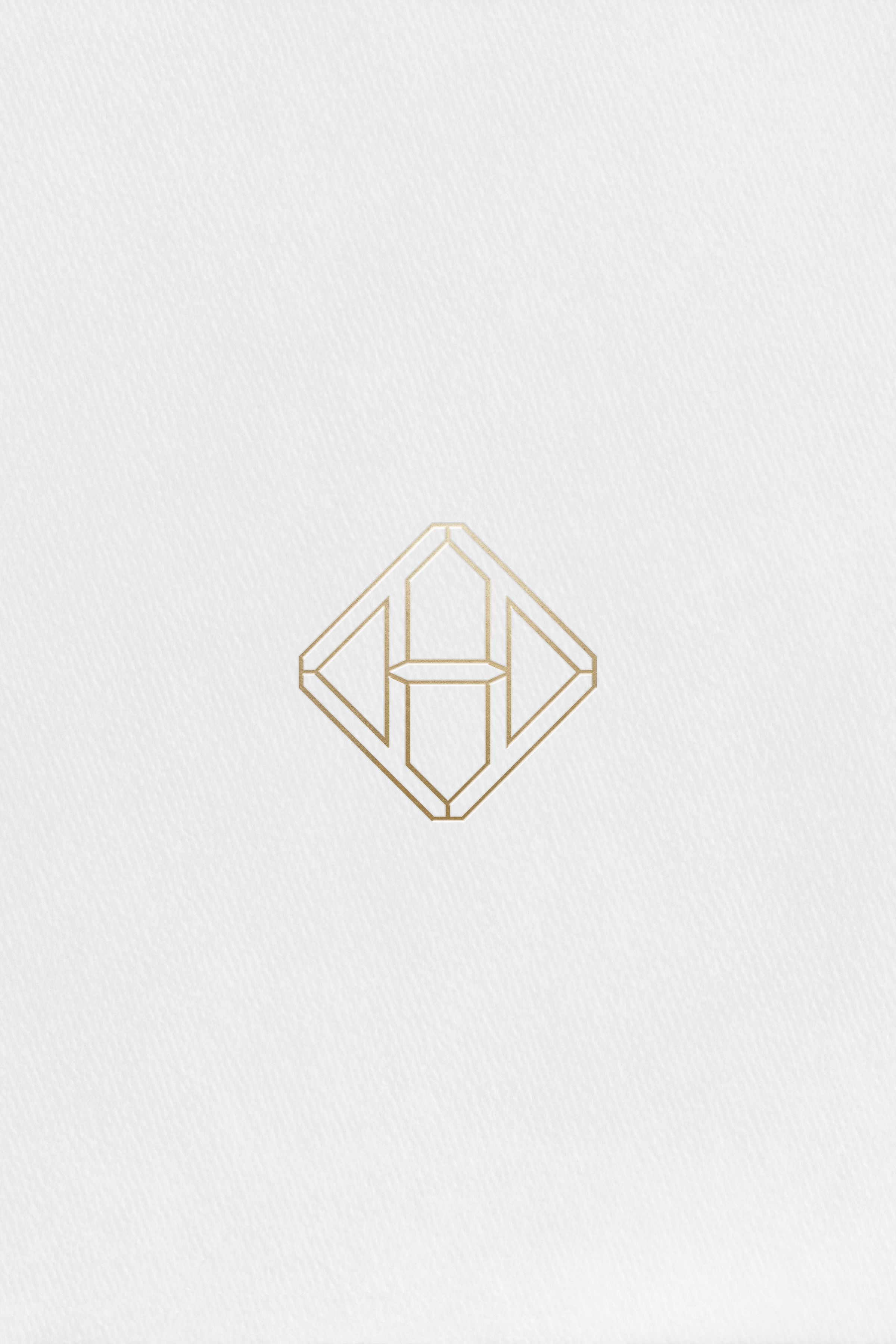 Hennessy H mark applied in gold foil to paper