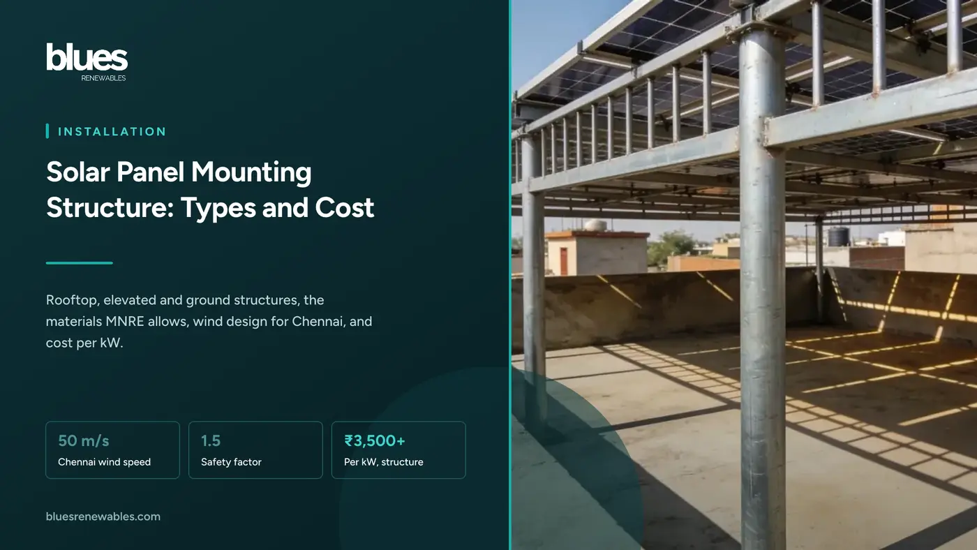 An elevated hot-dip galvanised steel solar structure on a Chennai terrace, with clothes drying in the shade beneath the panels