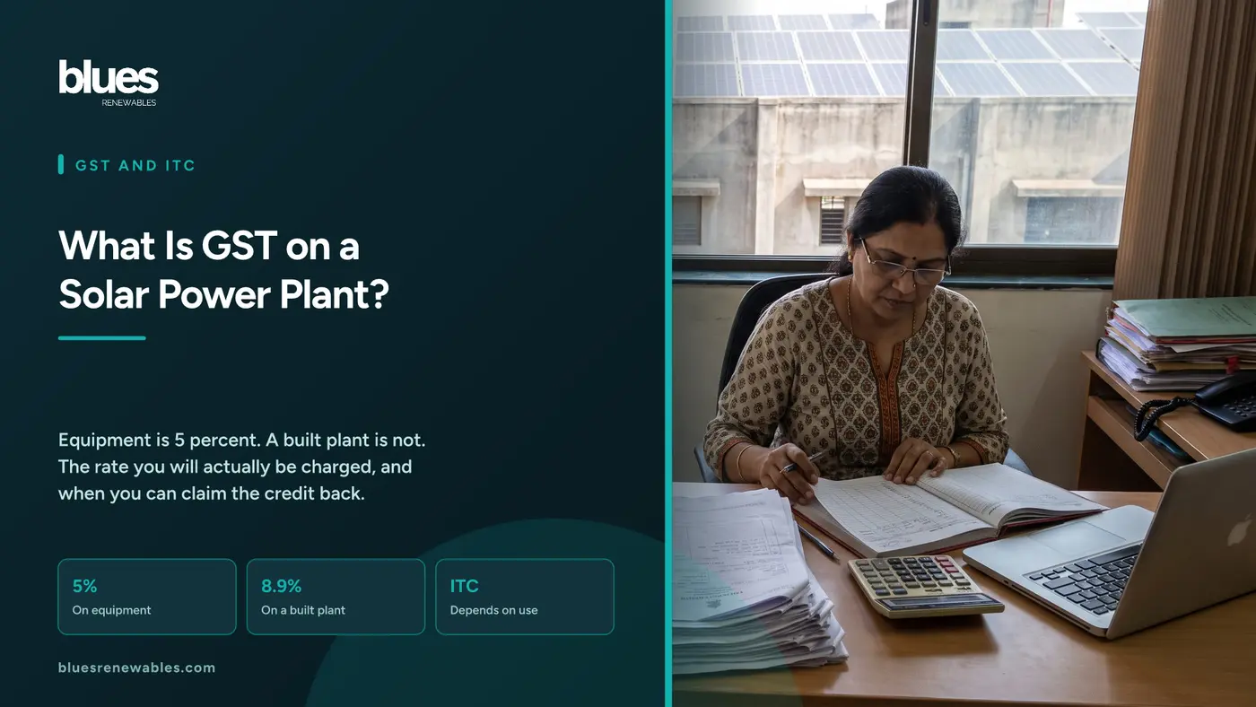 Indian businesswoman examining printed GST tax invoices and a ledger at her desk with solar panels on an industrial rooftop visible through the window