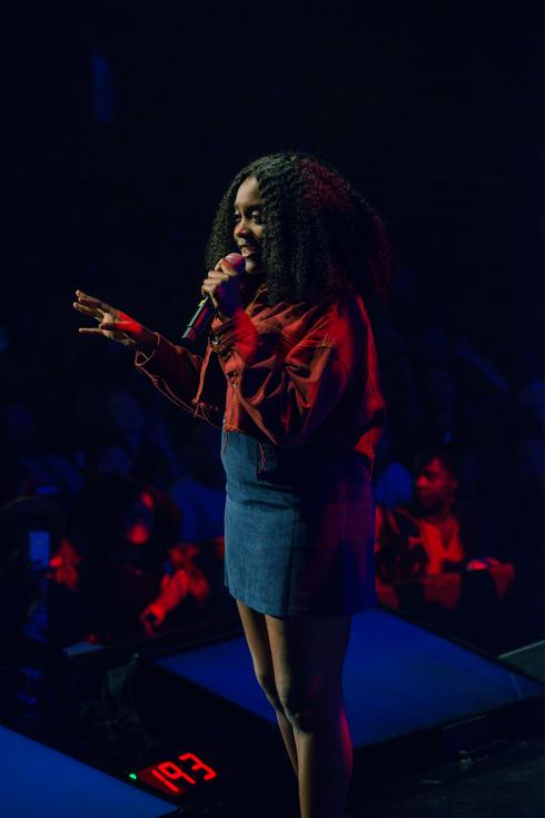 a woman performs on stage at Google Soulfest