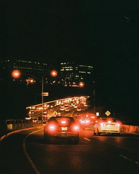Cars on the highway at night breaking
