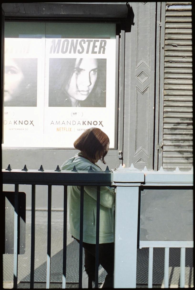 woman leaning against a rail