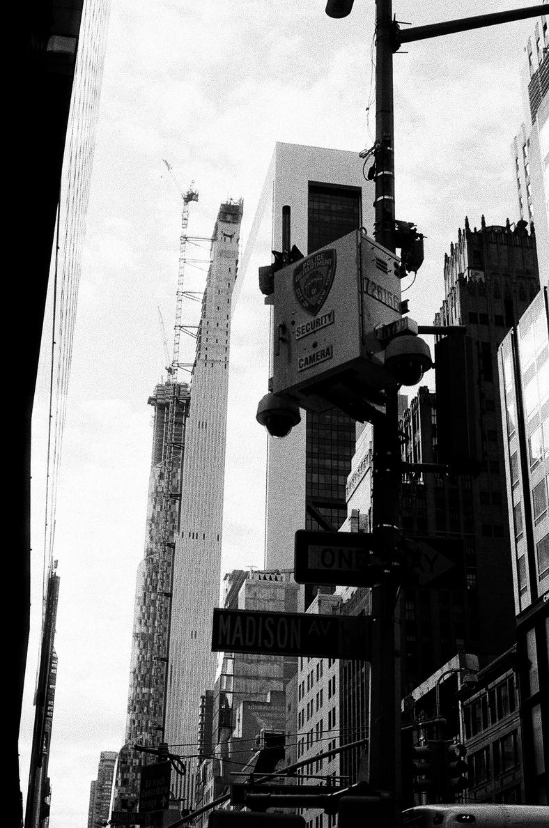 New York police department security cameras and a sign, on street light in New York City