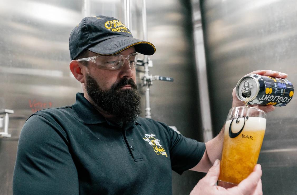 o'fallon brewery worker enjoying beer on job