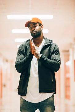 on of the coaches posing for a picture in a hallway at the niké sb 51 event