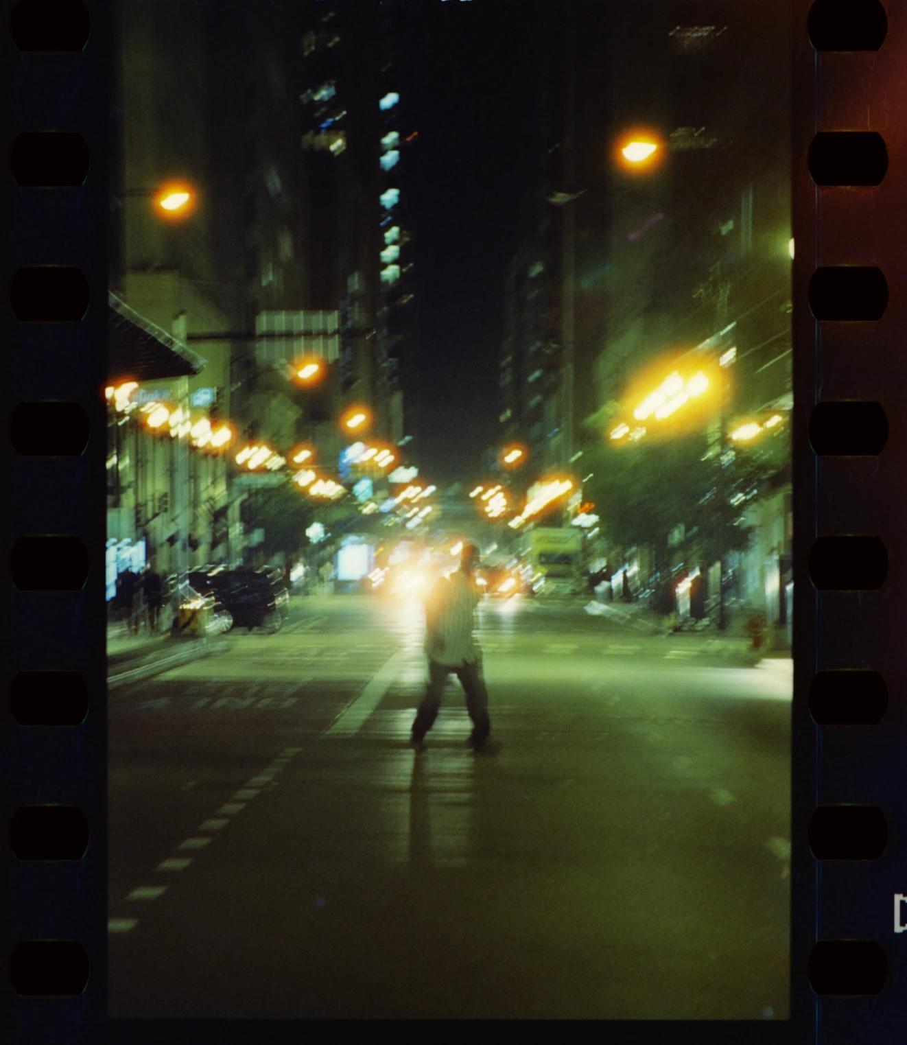 man crossing the street in new york city