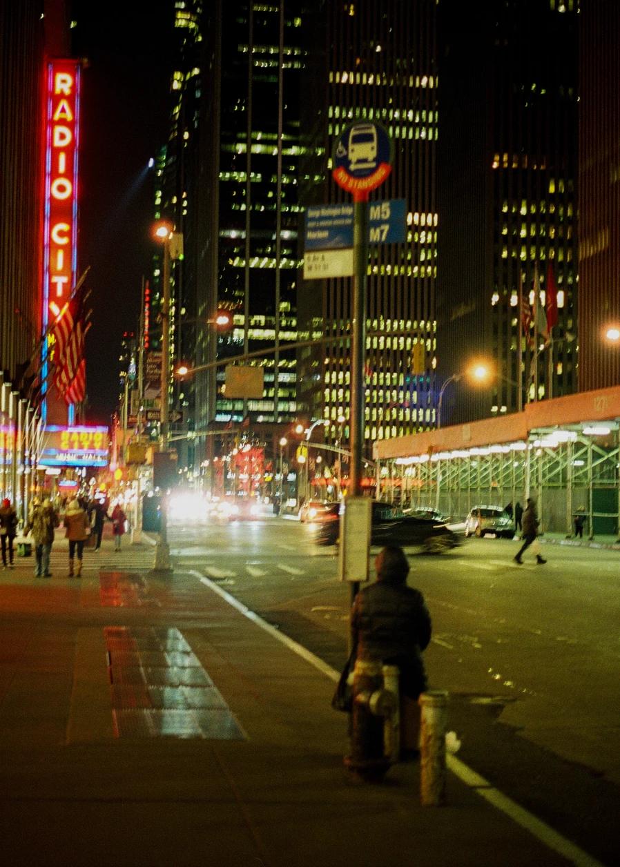 Radio city, New York, the sign can be seen further down the busy street in the middle of the night