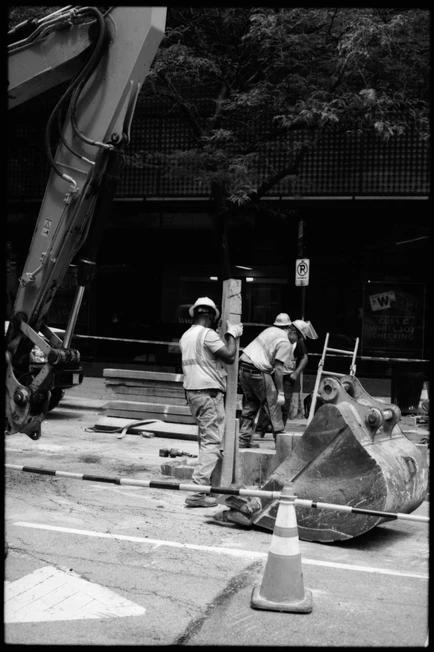 construction workers working on a city street