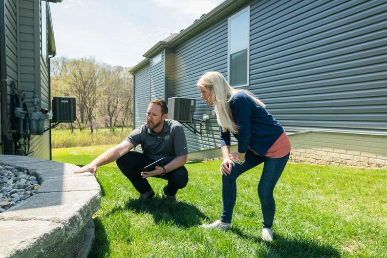 Amco Ranger employee goes through the details of the operation with the homeowner