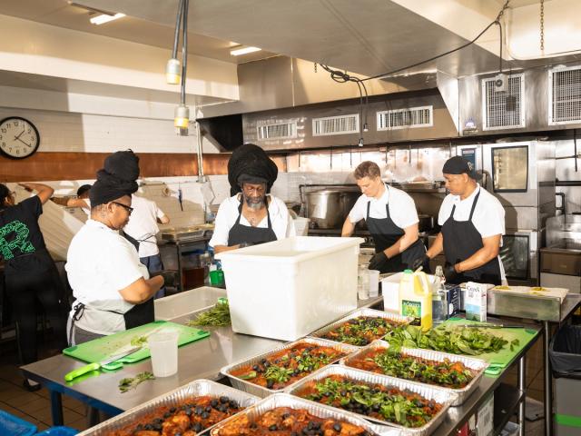 chefs inside kitchen prepping meals
