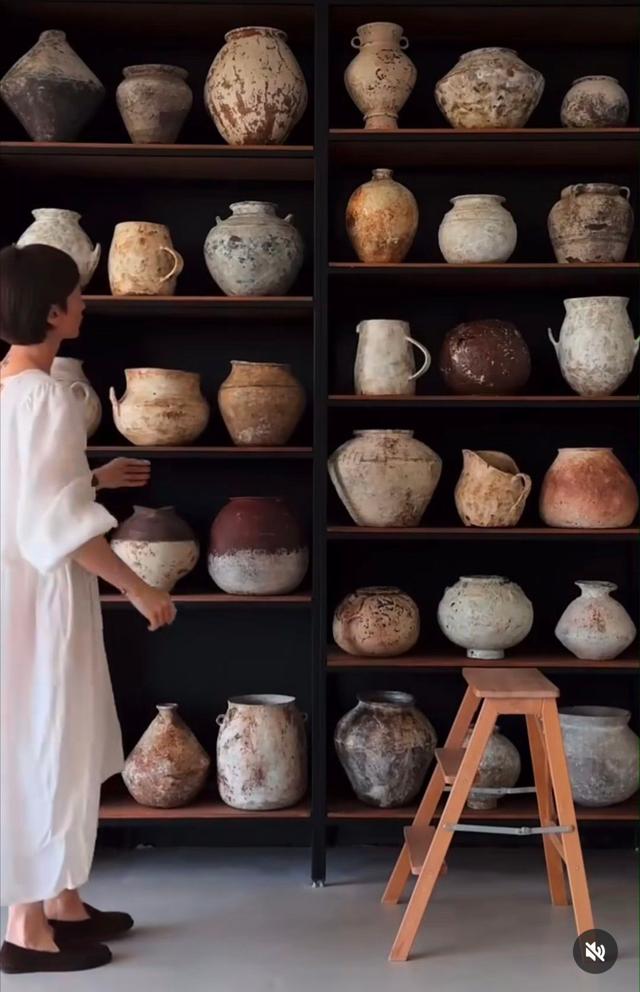 pottery on shelves on wall