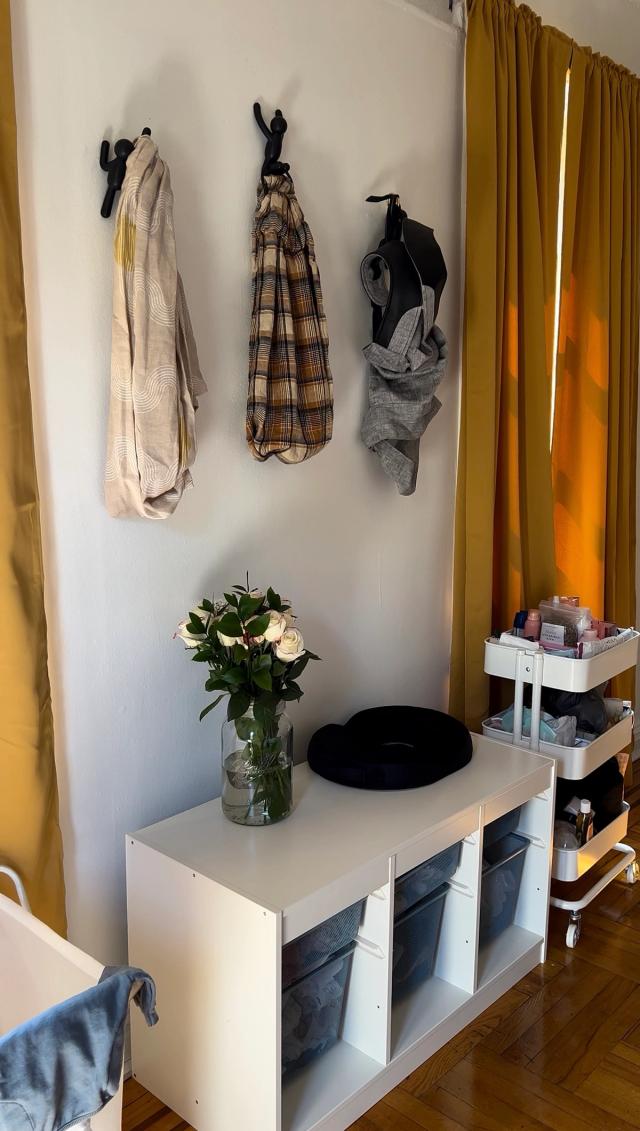 hooks above crib with jackets, bags, etc and lower drawers for storage