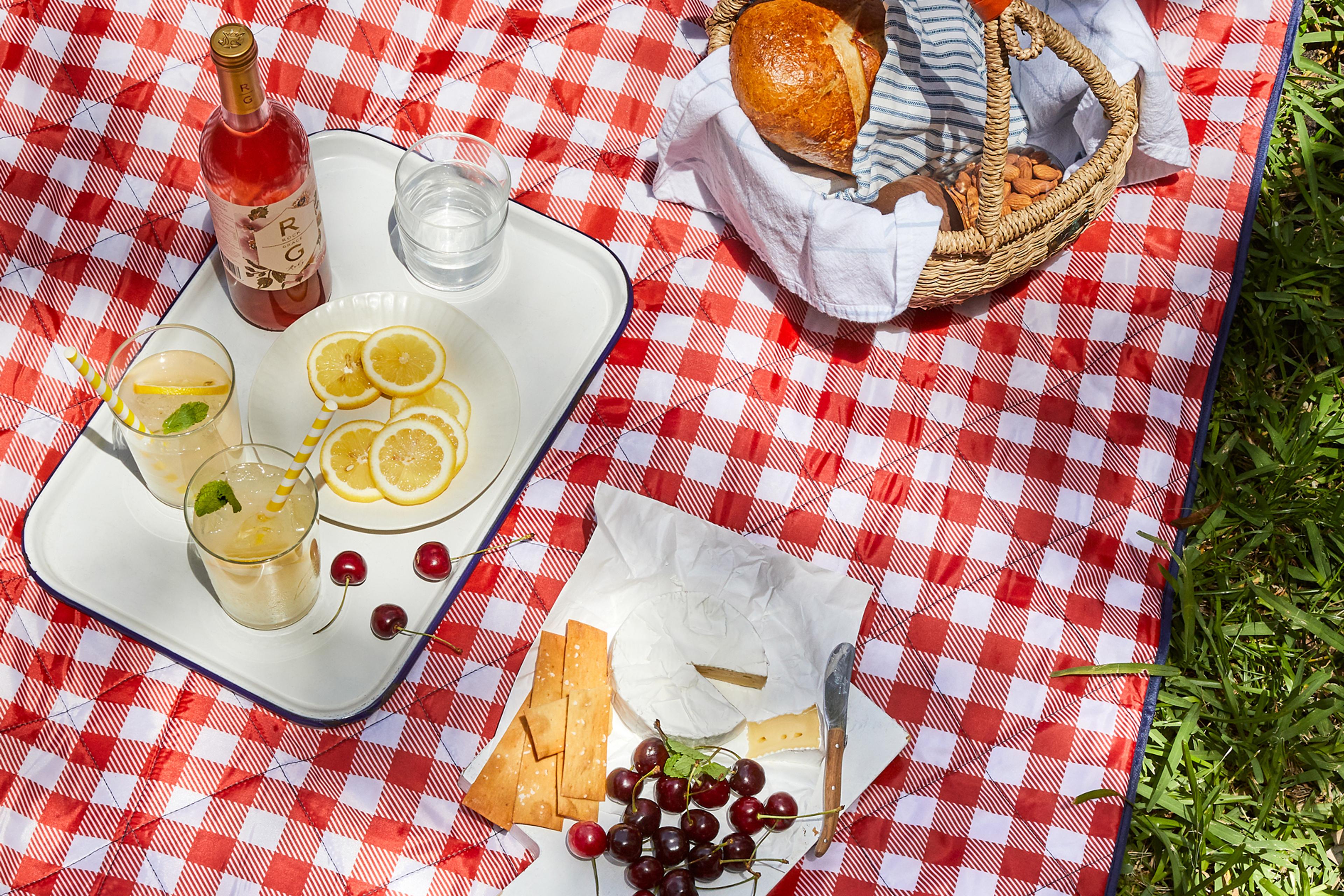 picnic blanket with charcturi and wine on it