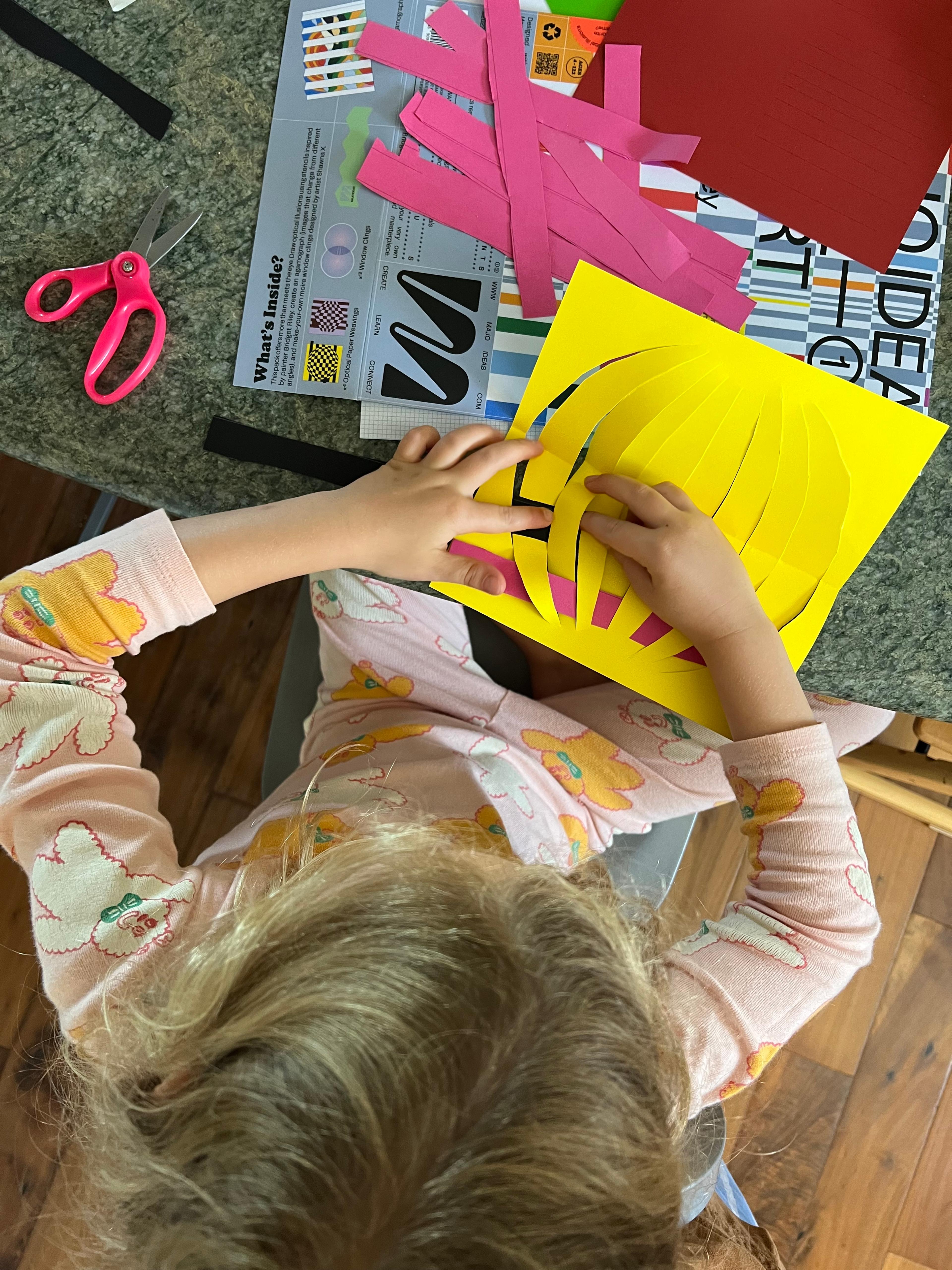 kids doing paper weaving craft